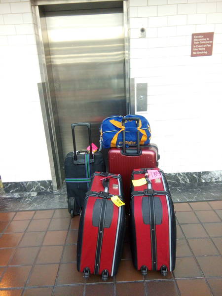 dragging luggage to the rental car