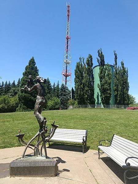 rusty statue and signal tower atop Council Crest